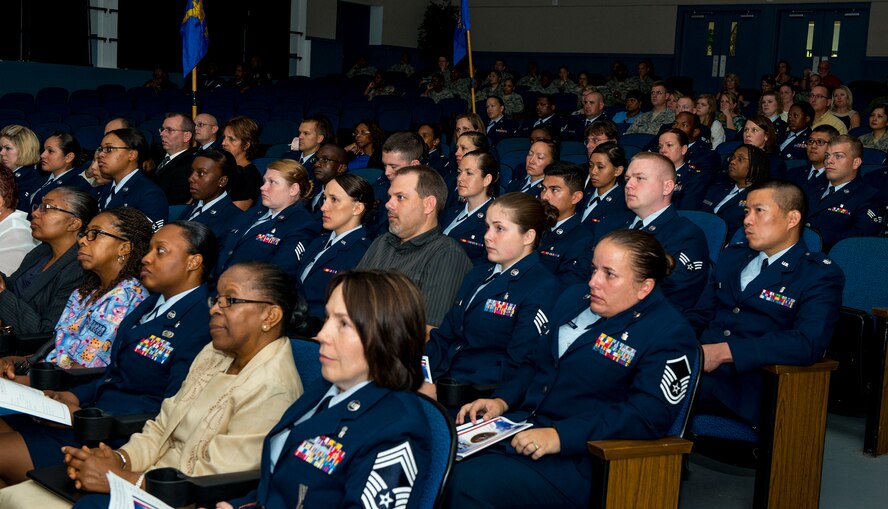 Members of the 23d Medical Group listen to a speech during a memorial ceremony for U.S. Air Force Master Sgt. LaTonya Dease at Moody Air Force Base, Ga., July 29, 2014. Dease was the 23d Aerospace Medicine Squadron flight chief of public health. (U.S. Air Force photo by Airman 1st Class Ceaira Tinsley/Released)