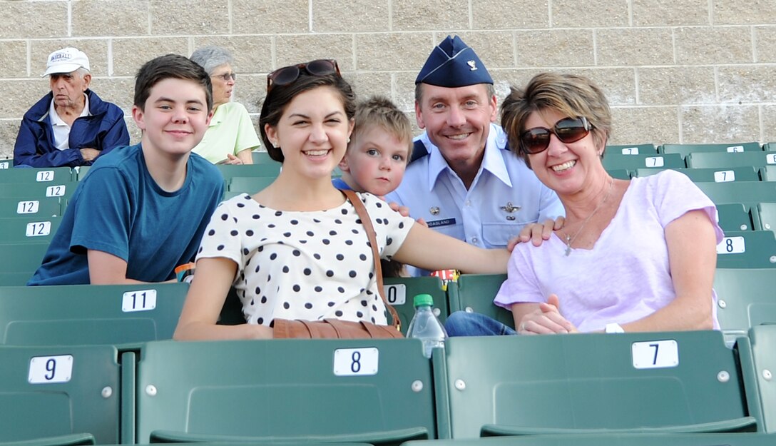 Col. Brad Hoagland, 11th Wing/Joint Base Andrews commander, and his family pose for a photo during the Bowie Baysox baseball game against the Altoona Curve at Prince George’s Stadium in Bowie, Md., July 25, 2014. Service members were in attendance for military appreciation night. (U.S. Air Force photo/Airman 1st Class Ryan J. Sonnier)