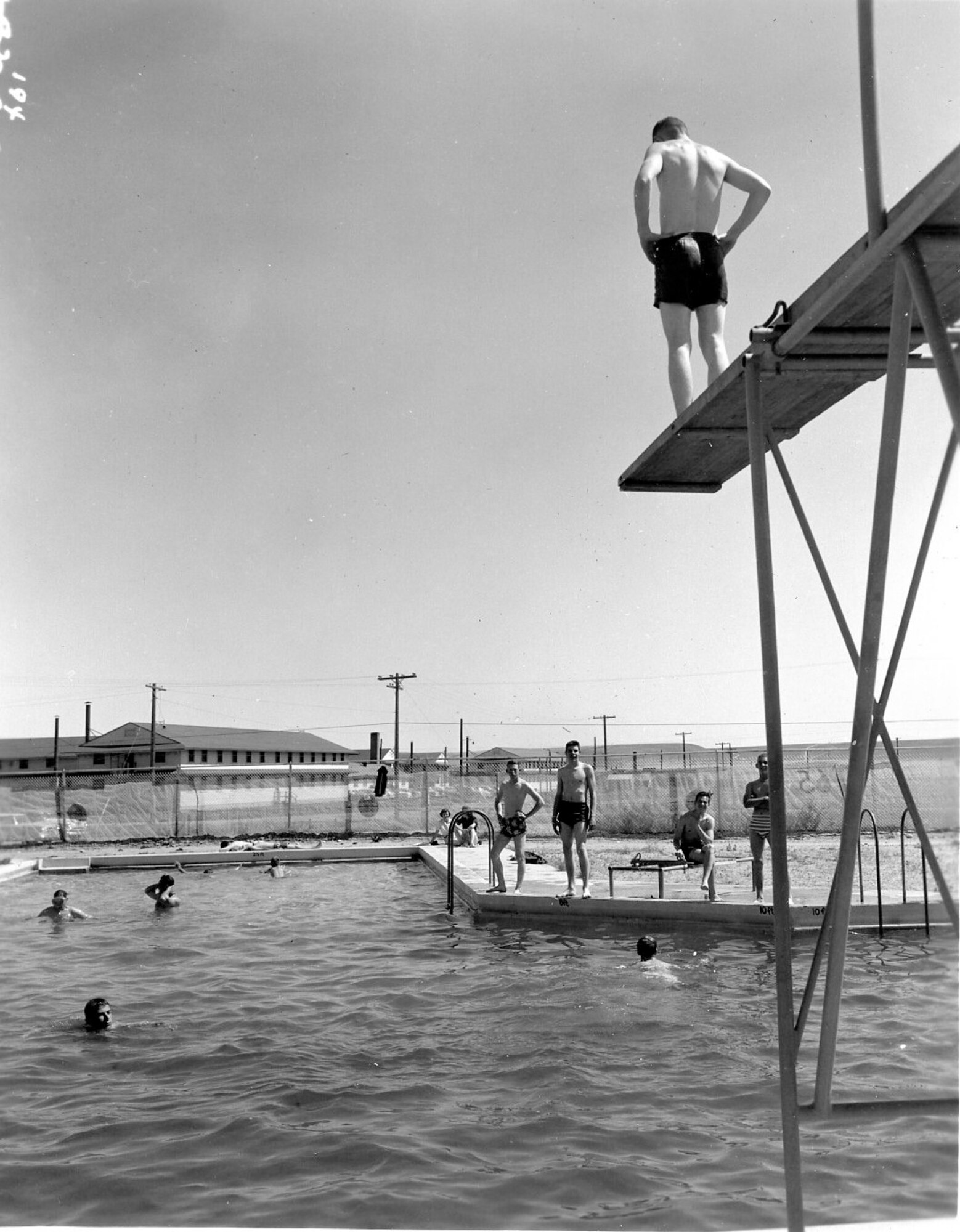 Air Guardsmen take a break from the heat at the Gowen Field base swimming pool during the summer training of June, 1954.  (Courtesy 142FW History Archives)