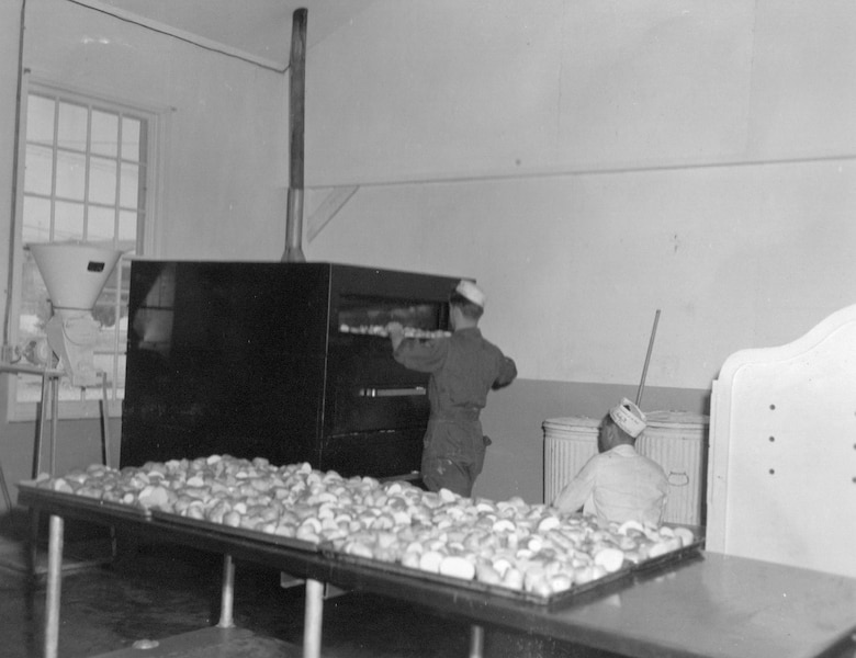 Bakers of the 142nd Food Service Squadron at work baking in preparation for a meal during annual training at Gowen Field, June 21, 1954.  (Courtesy 142FW History Archives)
