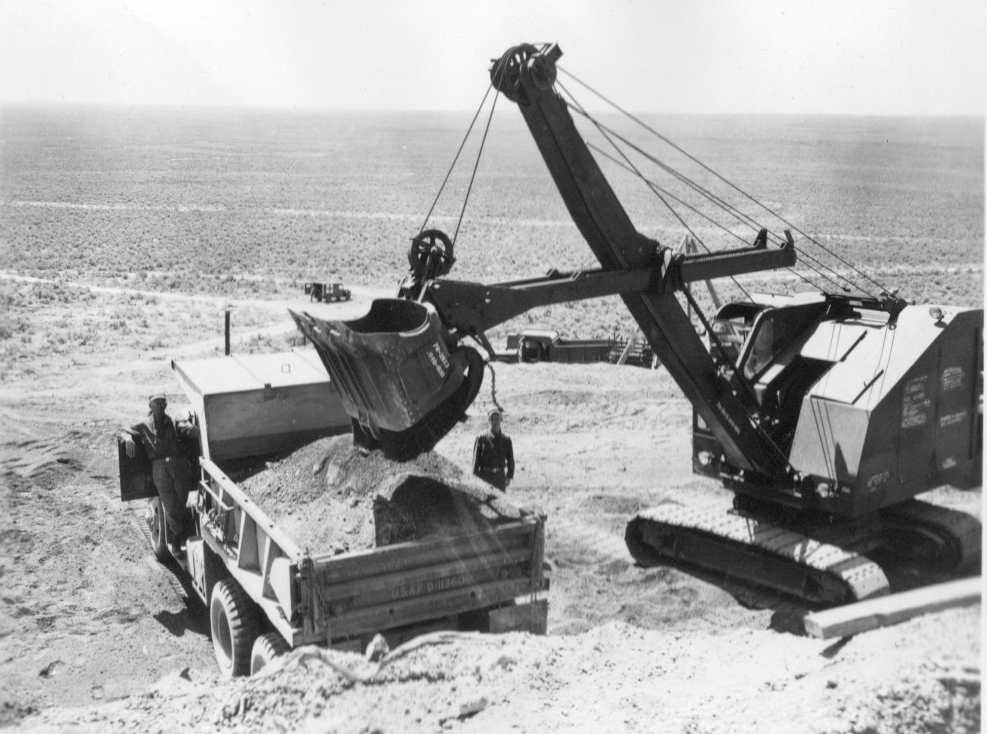 Aviation engineers of the 882nd Aviation Engineer Battalion operate heavy equipment as they work on the Gowen Field infrastructure some distance south of the main base in annual training of June, 1954.  The battalion’s Company C was from Portland, Ore.  (Courtesy 142FW History Archives)