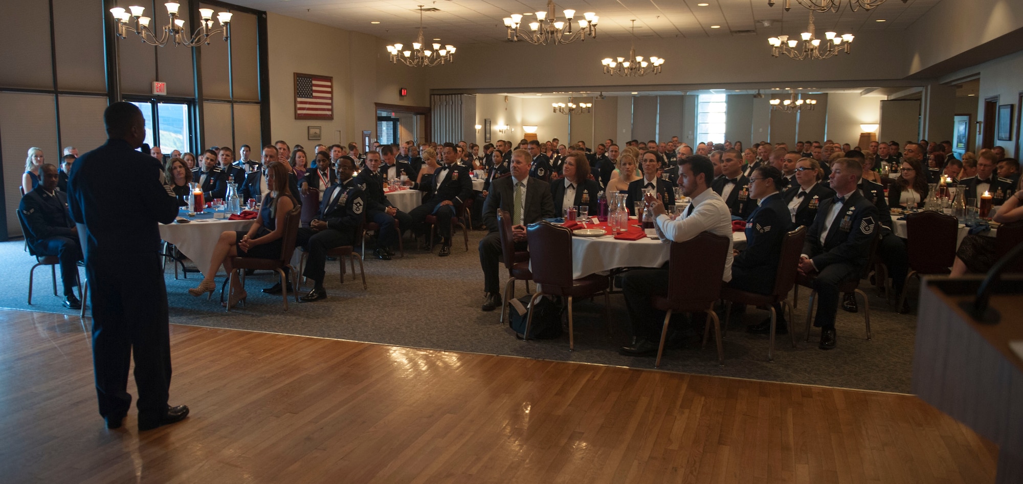 Retired U.S. Air Force Chief Master Sgt. Anthony Brinkley speaks at the Senior Noncommissioned Officers (SNCO) induction ceremony July 18, 2014, at Dyess Air Force Base, Texas.  Along with being the keynote speaker at the induction ceremony, Brinkley conducted a mentoring session with 31 inductees during a SNCO seminar held earlier in the week.  (U.S. Air Force photo by Airman 1st Class Kylsee
Wisseman/Released)
