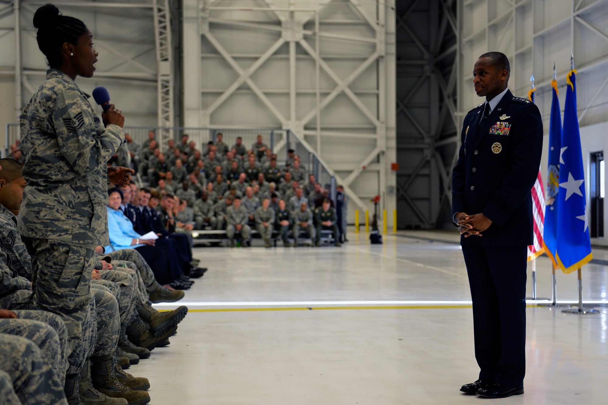 Tech. Sgt. Ebony Sanders, 627th Force Support Squadron NCO in charge of customer service, asks Gen. Darren McDew, Air Mobility Command commander about sexual harassment in the work place during an Airmen’s All Call July 25, 2014, at Joint Base Lewis-McChord, Wash. During the All Call, McDew discussed various topics including force shaping, sequestration and the Air Force’s future challenges. (U.S. Air Force photo/Staff Sgt. Russ Jackson) 