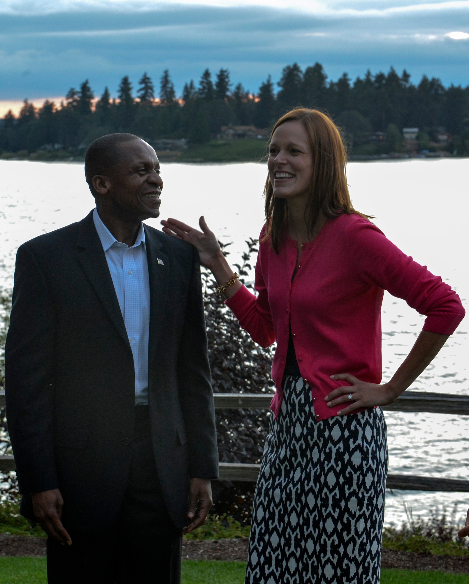 Gen. Darren McDew (left), Air Mobility Command commander, laughs with Mrs. Erin Griffin, wife of 62nd Airlift Wing vice commander Col. Ethan Griffin, at a civic leader social with base and community leaders July 24, 2014, at the Tacoma Country and Golf Club. Gen. and Mrs. McDew met with base leaders, spouses and community members during an informal evening at the club. (U.S. Air Force photo/Staff Sgt. Russ Jackson)