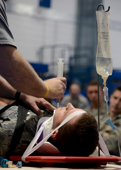 U.S. Air Force Airman 1st Class Justin Howard, 48th Logistics Readiness Squadron vehicle maintainer from Warrenton, Va., participates in a Street Smart demonstration July 28, 2014, on RAF Lakenheath, England.  As a part of the presentation, Howard was asked to be a simulated victim of a traumatic car accident. (U.S. Air Force photo/Airman 1st Class Victoria H. Taylor/Released)