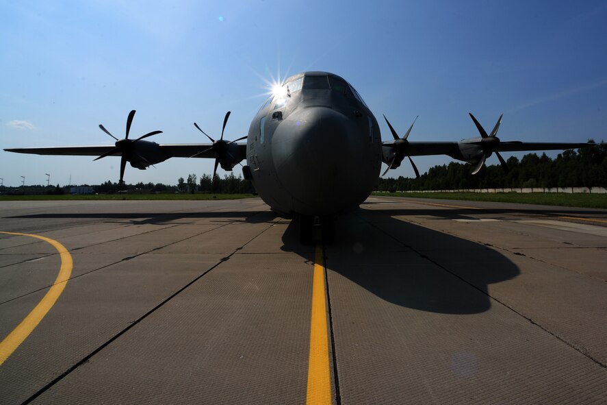An Air Force C-130J Super Hercules, deployed from Ramstein Air Base, Germany to Powidz Air Base, Poland, sits on the flightline at Siauliai Air Base, Lithuania, ready to receive Army and Lithuanian armed forces Soldiers, July 29, 2014. As the aircraft conducted low-level flight training, the paratroopers on board performed coordinated jumps over Lithuania. (U.S. Air Force photo/Staff Sgt. Jarad A. Denton)