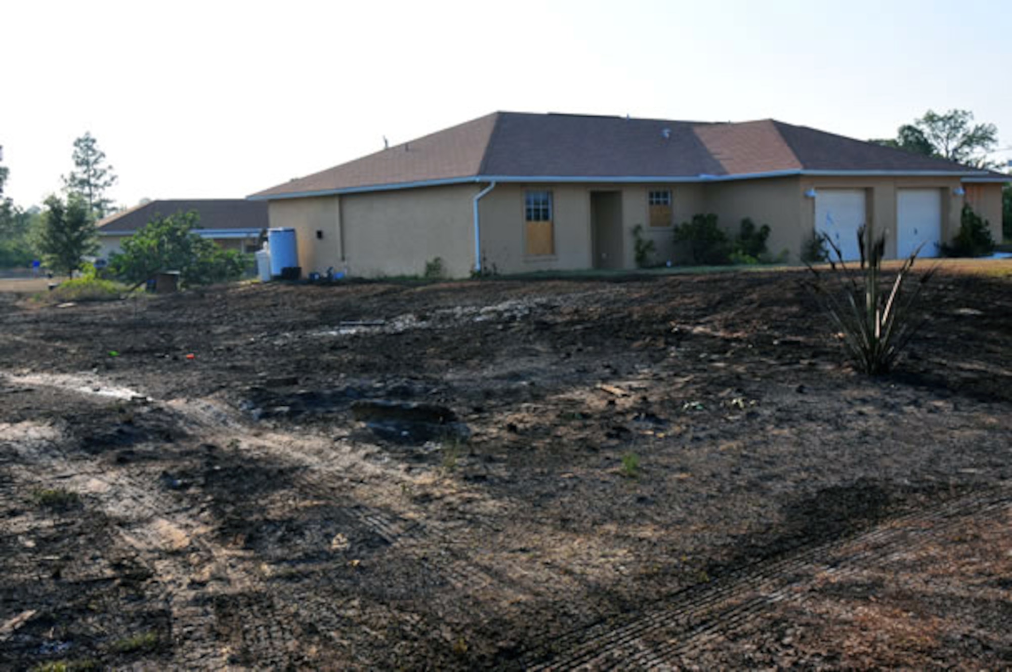 LEHIGH ACRES, Fla. -- A barbecue turned dangerous after one spark scorched more than an acre of an empty lot in a matter of minutes April 11, 2012. Be sure to use safe grilling practices as the peak months for grilling fires approach. (Courtesy photo)
