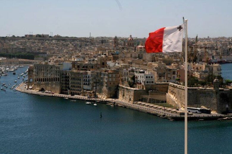 A Maltese flag flies on a clear day off the coast of Malta. The island country is a popular tourist destination located just south of Sicily. Out of all the European capitals, the capital of Malta has the warmest winters and the highest amount of sunshine per day. (Courtesy photo)