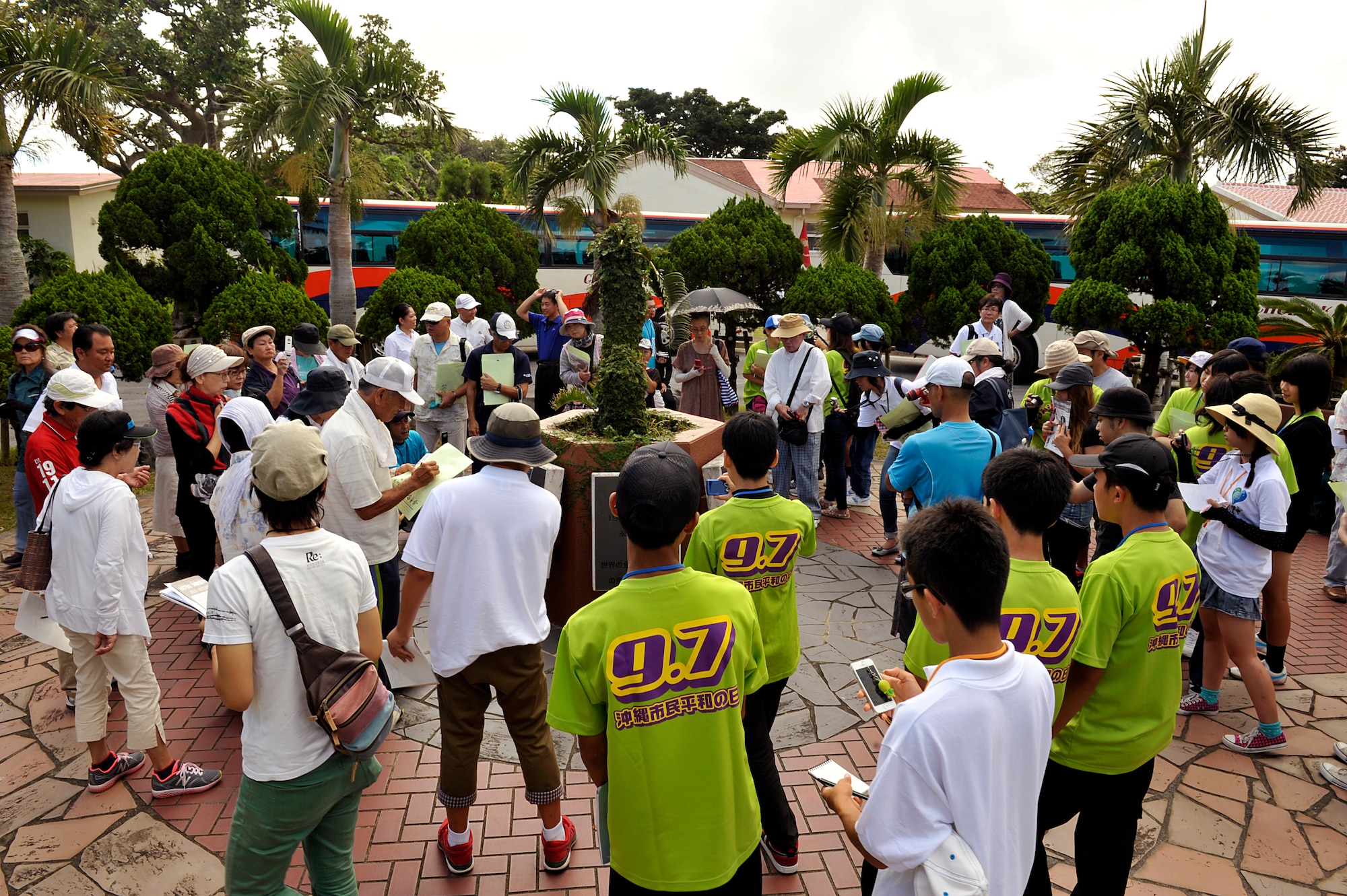 Okinawa City citizens examine monuments during an annual historical site visit on Kadena Air Base, Japan, July 29, 2014. Okinawa City has an established "Peace Month" from August 1 to September 7. During the "Peace Month" citizens are allowed to visit three war-related sites on Kadena. (U.S. Air Force photo by Naoto Anazawa/Released)