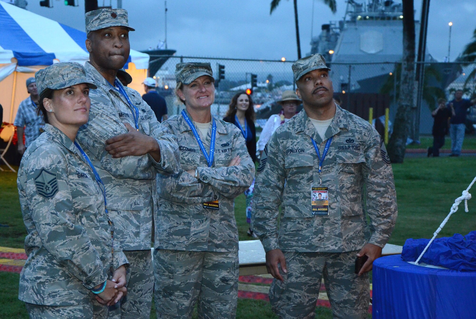 From right, Senior Master Sgt. Carl Nixon, PACAF flight chief for Air Force Reserve Command Recruiting Services (AFRS), Master Sgt. Charlene McCombs, PACAF in-service recruiter for AFRS,  Maj. Thomas McClyde, Jr., operations officer for Western Recruiting Squadron for AFRS, and Master Sgt. Sachel Garcia, PACAF line recruiter for AFRS watch a jumbotron at an AFRC-sponsored Memorial Day weekend event held at Ward Field, Naval Station Pearl Harbor, Joint Base Pearl Harbor-Hickam, Hawaii, May 24, 2014. The recruiting team worked the event as part of their effort to recruit Airmen for Air Force Reserve units located in Hawaii, Guam, Japan and Korea. (U.S. Air Force photo by Tech. Sgt. Phyllis Keith)
