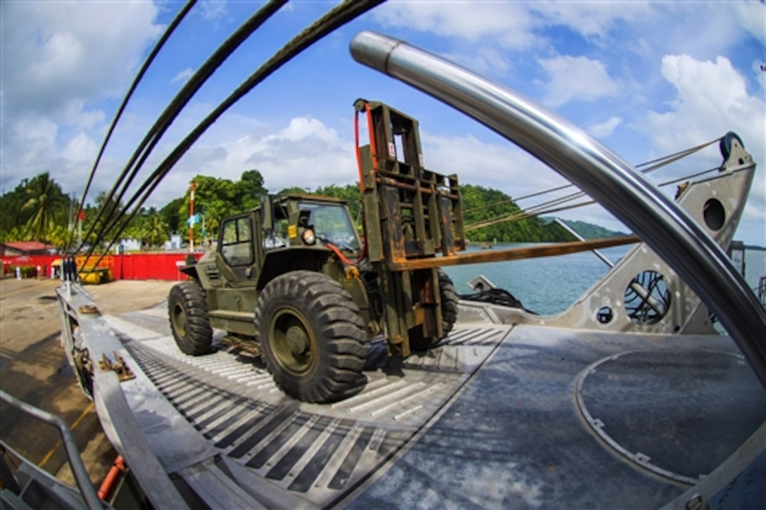 The Military Sealift Command joint high-speed vessel USNS Spearhead crew and service members offload gear and vehicles in support of Southern Partnership Station 2014 in Puerto Barrios, Guatemala, July 22, 2014. Southern Partnership Station is a U.S. Navy deployment focused on subject matter expert exchanges with partner nation militaries and security forces. 