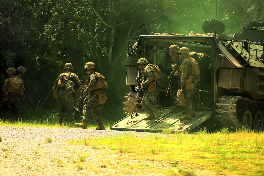 U.S. Marines with Company I, Battalion Landing Team, 3rd Battalion, 5th Marines, 31st Marine Expeditionary Unit (MEU) conduct a mechanized raid as part of MEU Exercise (MEUEX) aboard Camp Schawb, Okinawa, Japan, July 17, 2014. The MEUEX is part of the pre-deployment training in preparation for the fall patrol. (U.S. Marine Corps Photo by GySgt Ismael Pea/ Released)