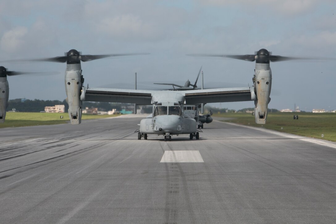 An MV-22B Osprey tiltrotor aircraft taxis down the flight line prior to takeoff during an air training exercise July 16 at Marine Corps Air Station Futenma. The training exercise consisted of vertical assault and seize-and-capture scenarios. The aircraft is with Marine Medium Tiltrotor Squadron 265 Reinforced, 31st Marine Expeditionary Unit.  (U.S. Marine Corps photo by Lance Cpl. Tyler S. Giguere/Released)