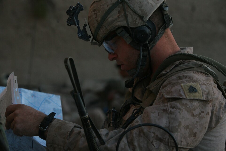 Sergeant Levi J. Slife, a joint terminal air controller, gives a class on reads a map in preparation of calling close-air support at Afghanistan 2010. The JTAC is the chief designator of artillery or close-air support ordinance and has the final say with the pilot or gunner before they commit to the attack. Slife is with Company I, Battalion Landing Team 3rd Bn., 5th Marines, 31st Marine Expeditionary Unit, and a native of Littleton, Colorado.(Courtesy photo provided by Sgt. Levi J. Slife during his second tour in Afghanistan)
