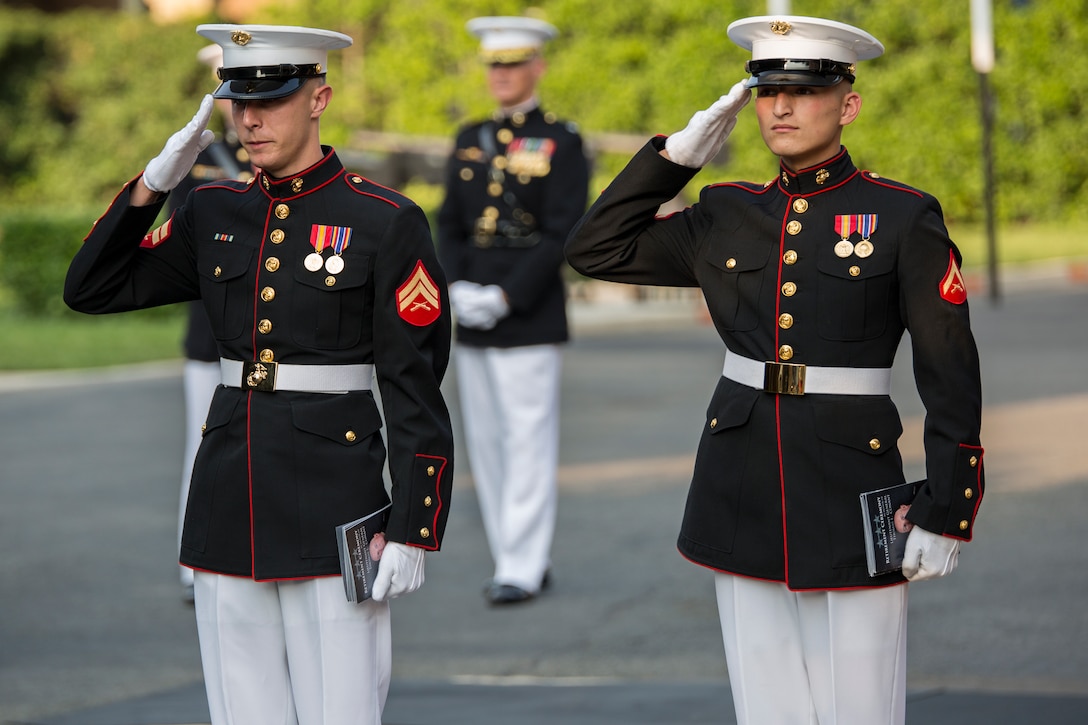 Marines from Marine Barracks Washington, D.C., greet guests prior to a retirement ceremony at Marine Barracks Washington, D.C., for Lt. Gen. Thomas Conant, deputy commander of U.S. Pacific Command, July 30.