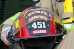 Army Sgt. Max Stoltenburg, lead firefighter from the South Dakota Army National Guard's 451st Engineering Detachment Firefighting Team, holds his helmet at Camp Marmal, Afghanistan, Jan. 9, 2012. The 451st EDFT works as a part of the International Security Assistance Force in northern Afghanistan. ISAF Regional Command North supports Afghan National Security Forces in close coordination and collaboration in providing security and disrupting insurgent activities in order to protect the Afghan population.