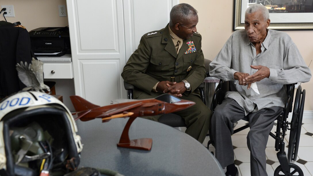 Lt. Gen. Frank E. Petersen, Jr. (ret), right, converses with Lt. Gen. Ronald Bailey, the deputy commandant for plans, policies, and operations with Headquarters Marine Corps during a home visit where he was presented with a Congressional Record statement at his home in Stevensville, Maryland, July 28. 