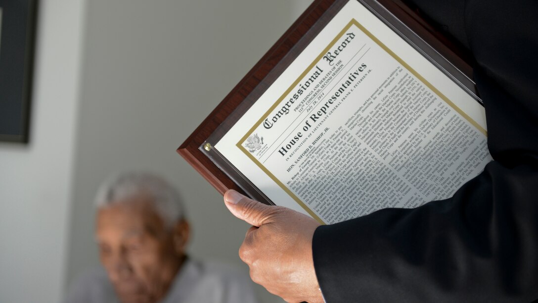 A Congressional Record statement was presented to Lt. Gen. Frank E. Petersen, Jr. (ret.) by U.S. Rep. Sanford D. Bishop, Jr., honoring his significant accomplishments throughout his military career at his home in Stevensville, Maryland July 28. 