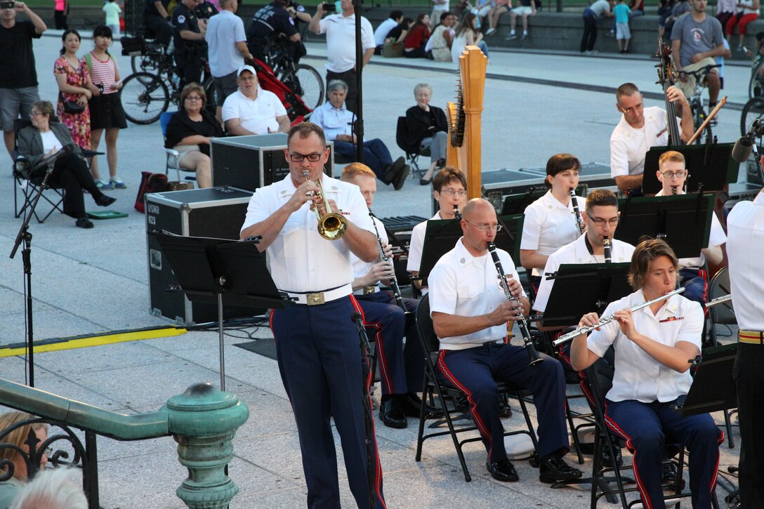 On July 30, 2014, Lt. Col. Jason K. Fettig conducted his first Marine Band Summer Fare concert at the U.S. Capitol. The program featured cornet/trumpet player Gunnery Sgt. Brad Weil performing Kenny Baker's "Virtuosity" and mezzo-soprano vocalist Gunnery Sgt. Sara Dell'Omo singing Stephen Sondheim's "You (I) Could Drive a Person Crazy." (U.S. Marine Corps photo by Master Sgt. Kristin duBois/released)