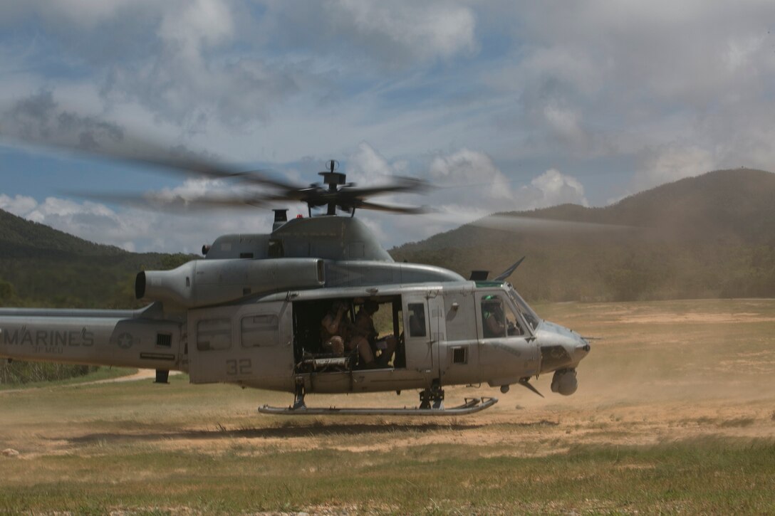 A UH-1 Huey takes off from the Central Training Area in response to a simulated medical evacuation scenario July 16 during an air training exercise. The Huey was used as a medical evacuation response and command post during the exercise. The aircraft is with Marine Light Attack Helicopter Squadron 467, Marine Aircraft Group 29, currently attached to Marine Medium Tiltrotor Squadron 265 Reinforced, 31st Marine Expeditionary Unit. (U.S. Marine Corps photo by Lance Cpl. Tyler S. Giguere/Released)