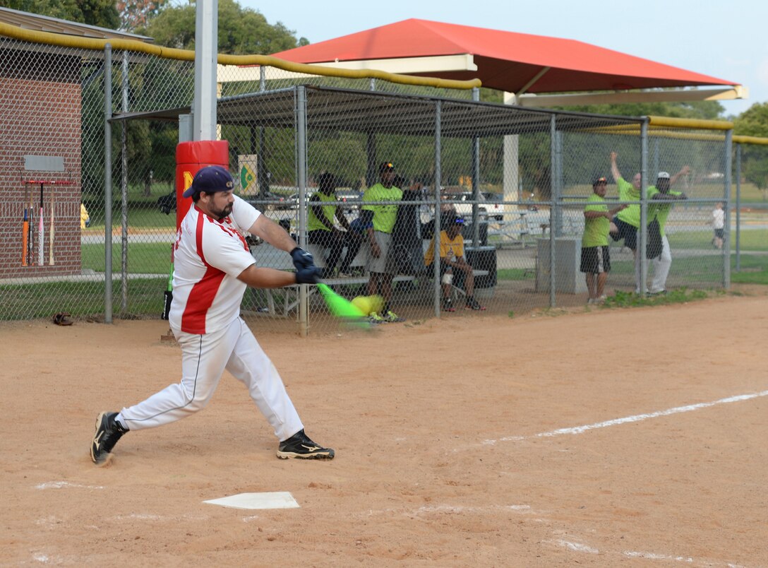 Paint Shop's third baseman, Jeremy Bryant, swings on a pitch during the final game of the 2014 season. Paint Shop defeated Weapons 5-3 for the championship title in a softball play-off game at Marine Corps Logistics Base Albany's Crouch Field, July 23.