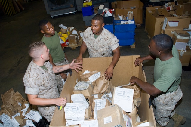 Marine reservists from Detachment 2, Combat Logistics Battalion-453, Combat Logistics Regiment-4, 4th Marine Logistics Group, sort through gear returning from Iraq and Afghanistan, during their annual training, here, July 24.