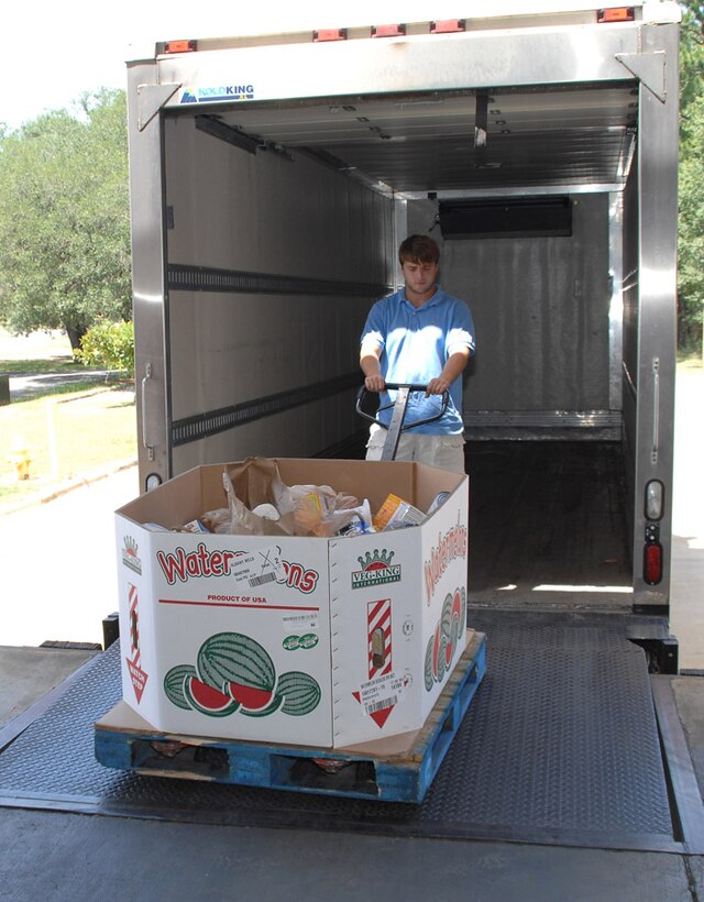 Noah Horton, driver for Second Harvest Food Bank, Albany, Georgia, picks up 1,060 pounds of food for the “Feds Feed Families” campaign at Marine Corps Logistics Base Albany’s Commissary, Tuesday. The campaign will end Aug. 31. This the third year the Commissary has participated in the event. The food drive provides food and assistance to those in need within the local community.