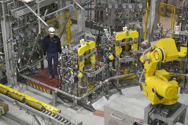 Inside the Agent Processing Building of the Pueblo Chemical Agent Destruction Pilot Plant, a start-up specialist tests the Cavity Access Machines of the Munitions Washout System. Specialized robots, procured by Huntsville Center, transfer materials to the appropriate stations. For each disposal site, Huntsville Center staff has developed initial facility design requirements and identified appropriate equipment based on the approved destruction technology.