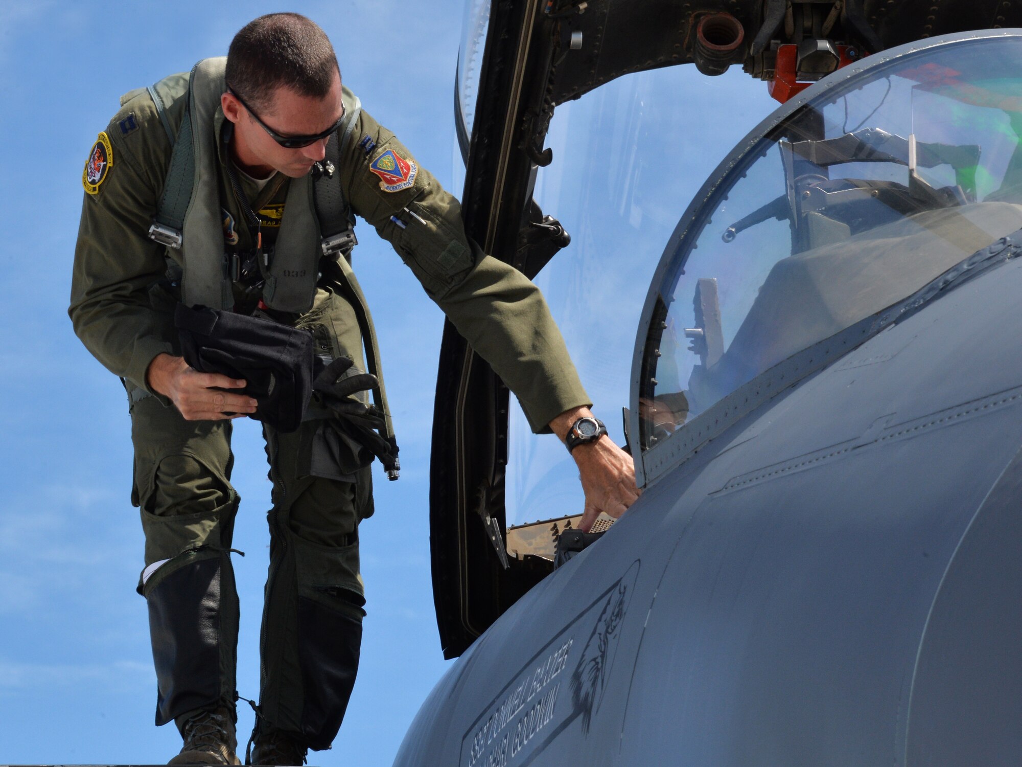 Capt. Patrick Hickie III prepares to enter an aircraft during a mission July 16, 2014, at Joint Base Pearl Harbor-Hickam, Hawaii. The 391st Fighter Squadron is currently on a two-month deployment here from Mountain Home Air Force Base, Idaho. While here, the squadron’s F-15E Strike Eagles have participated in Rim of the Pacific 2014 exercise missions. RIMPAC is a U.S. Pacific Command-hosted biennial multinational maritime exercise designed to foster and sustain international cooperation on the security of the world’s oceans. Hickie is a 391st FS F-15E weapon systems officer. (U.S. Air Force photo/Staff Sgt. Alexander Martinez)