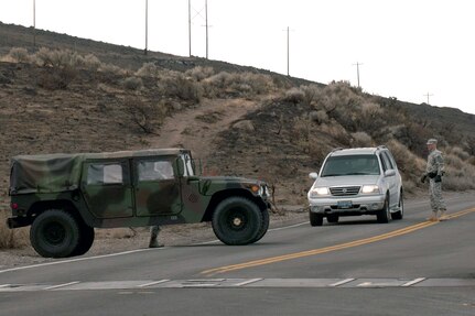 Nevada Army National Guard Spec. Gregory Walker of the 485th Military Police Company helps man an entry control point on Eastlake Boulevard near the junction with Highway 395 on Jan. 20, 2012. Guard members assisted local law enforcement securing the area around the Washoe Drive Fire.