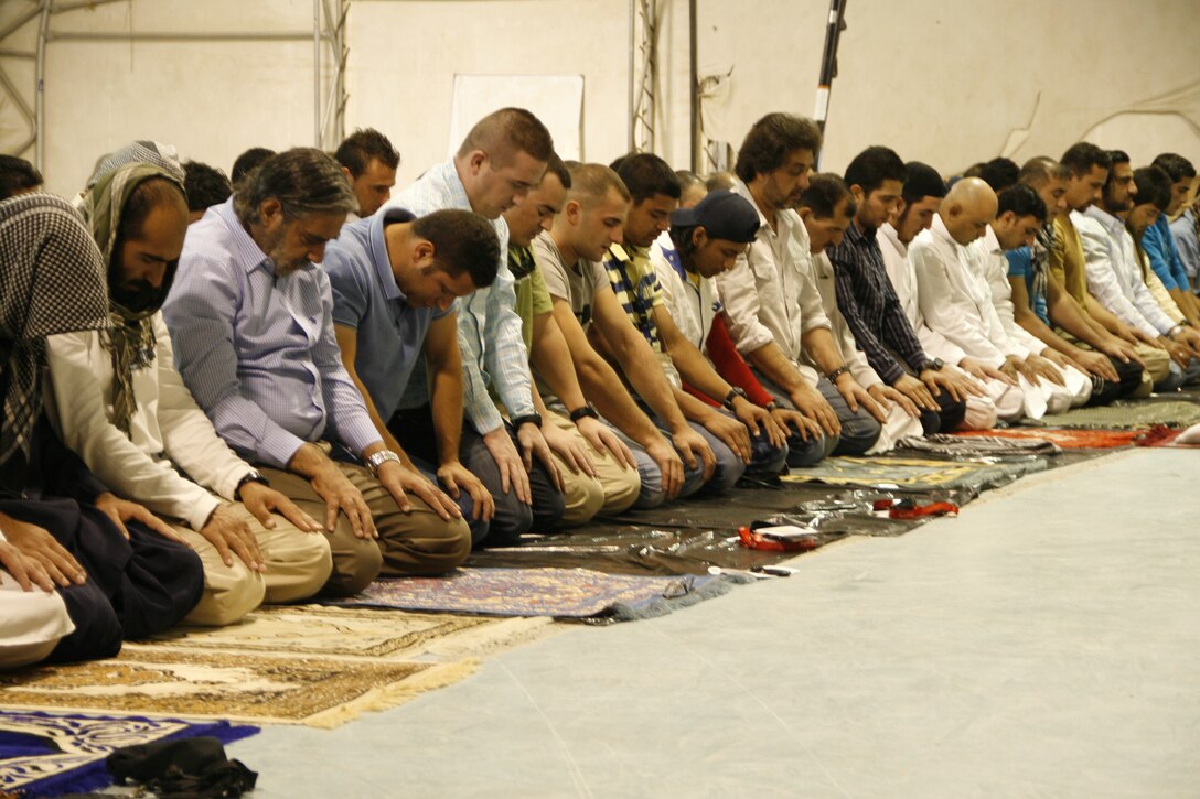Coalition service members and civilian contractors participate in an Eid al-Fitr ceremony held aboard Camp Leatherneck, Helmand province, Afghanistan, July 28, 2014. The ceremony marked the end of Ramadan, which is a monthlong holiday that millions of Muslims observe each year by fasting from morning to evening.


