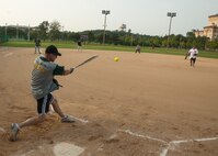 The 8th Maintenance Squadron Dragons play the 8th Civil Engineer Squadron Red Devils during the squadron championship softball game at Kunsan Air Base, Republic of Korea, July 30, 2014. The game’s final score ended with the Dragons taking the win, 14 to 9. (U.S. Air Force photo by Staff Sgt. Jose Rodriguez/Released)