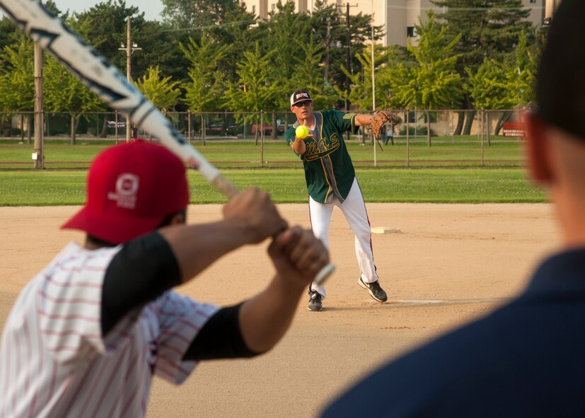 The 8th Maintenance Squadron Dragons play the 8th Civil Engineer Squadron Red Devils during the squadron championship softball game at Kunsan Air Base, Republic of Korea, July 30, 2014. The game’s final score ended with the Dragons taking the win, 14 to 9. (U.S. Air Force photo by Staff Sgt. Jose Rodriguez/Released)