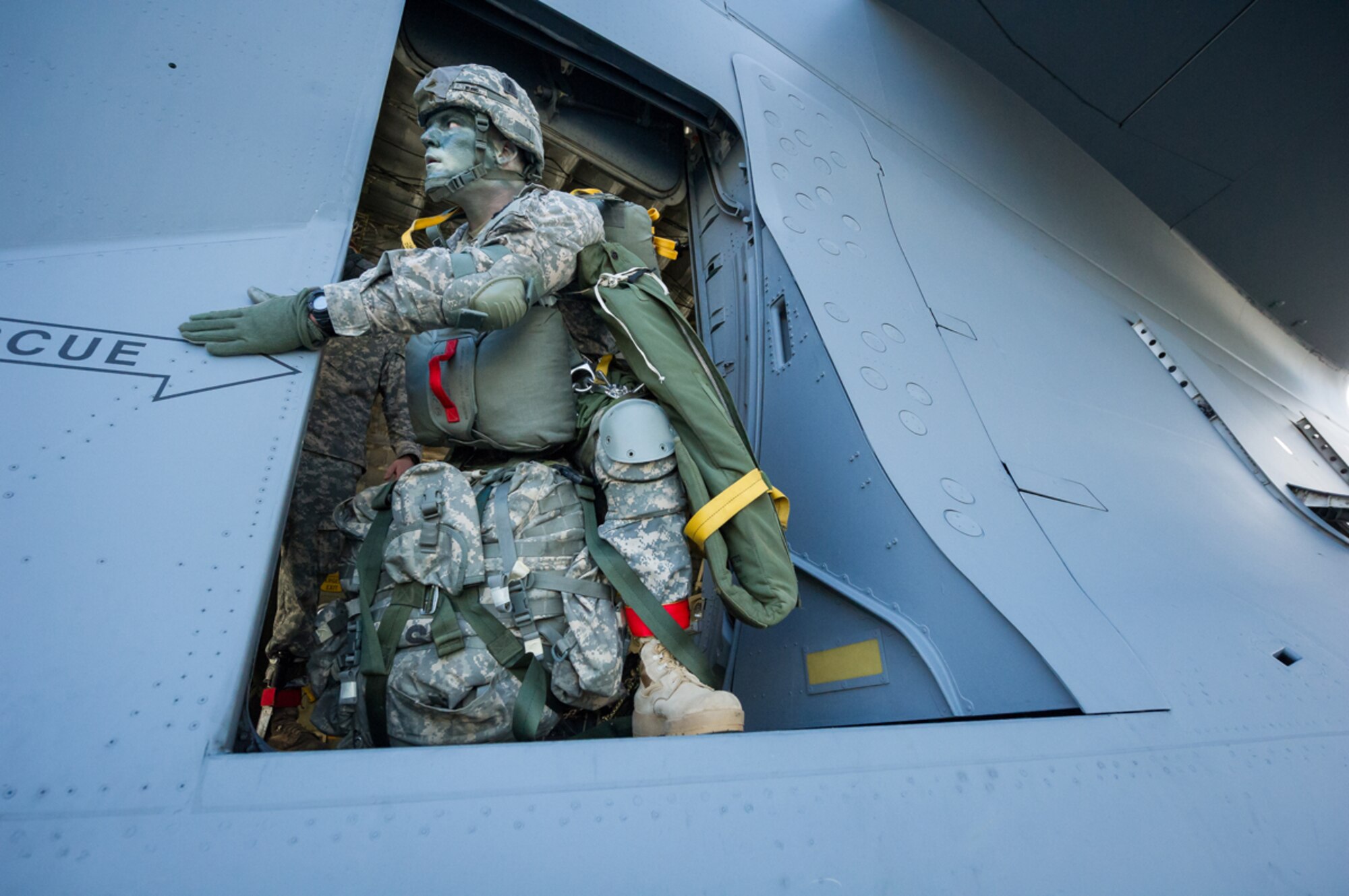 Army Staff Sgt. Benjamin Nenno, assistant jumpmaster assigned to B Co, 3rd Battalion (Airborne), 509th Infantry Regiment, 4th Brigade Combat Team (Airborne), 25th Infantry Division, U.S. Army Alaska, rehearses troop door safety inspection procedures aboard a C-17 Globemaster III in preparation for a show of force demonstration at Arctic Thunder Open House 2014, July 26, 2014. Arctic Thunder is a biennial event hosted by Joint Base Elmendorf-Richardson, Alaska. Featuring more than 40 Air Force, Army and civilian aerial acts and an expected crowd of more than 200,000 people, it is the largest two-day event in the state and one of the premier aerial demonstrations in the world. The 2014 Arctic Thunder Open House is a proud part of the Anchorage Centennial Celebration. (U.S. Air Force photo by Master Sgt. John R. Nimmo, Sr./Released)
