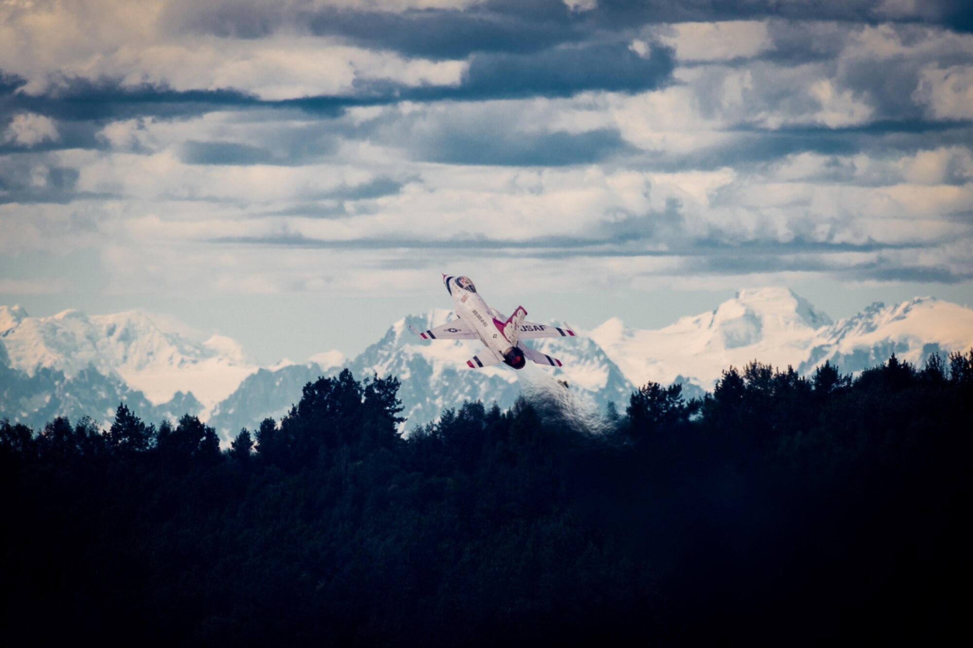 U.S. Air Force Thunderbirds Maj. Blaine Jones, Thunderbird 5, Lead Solo, completes the High Alpha during the Arctic Thunder Open House biennial event hosted by Joint Base Elmendorf-Richardson, Alaska, July 27, 2014. Arctic Thunder is a biennial event hosted by JBER. Featuring more than 40 Air Force, Army and civilian aerial acts and an expected crowd of more than 200,000 people, it is the largest two-day event in the state and one of the premier aerial demonstrations in the world. The 2014 Arctic Thunder Open House is a proud part of the Anchorage Centennial Celebration. (U.S. Air Force photo by Master Sgt. John R. Nimmo, Sr./Released)