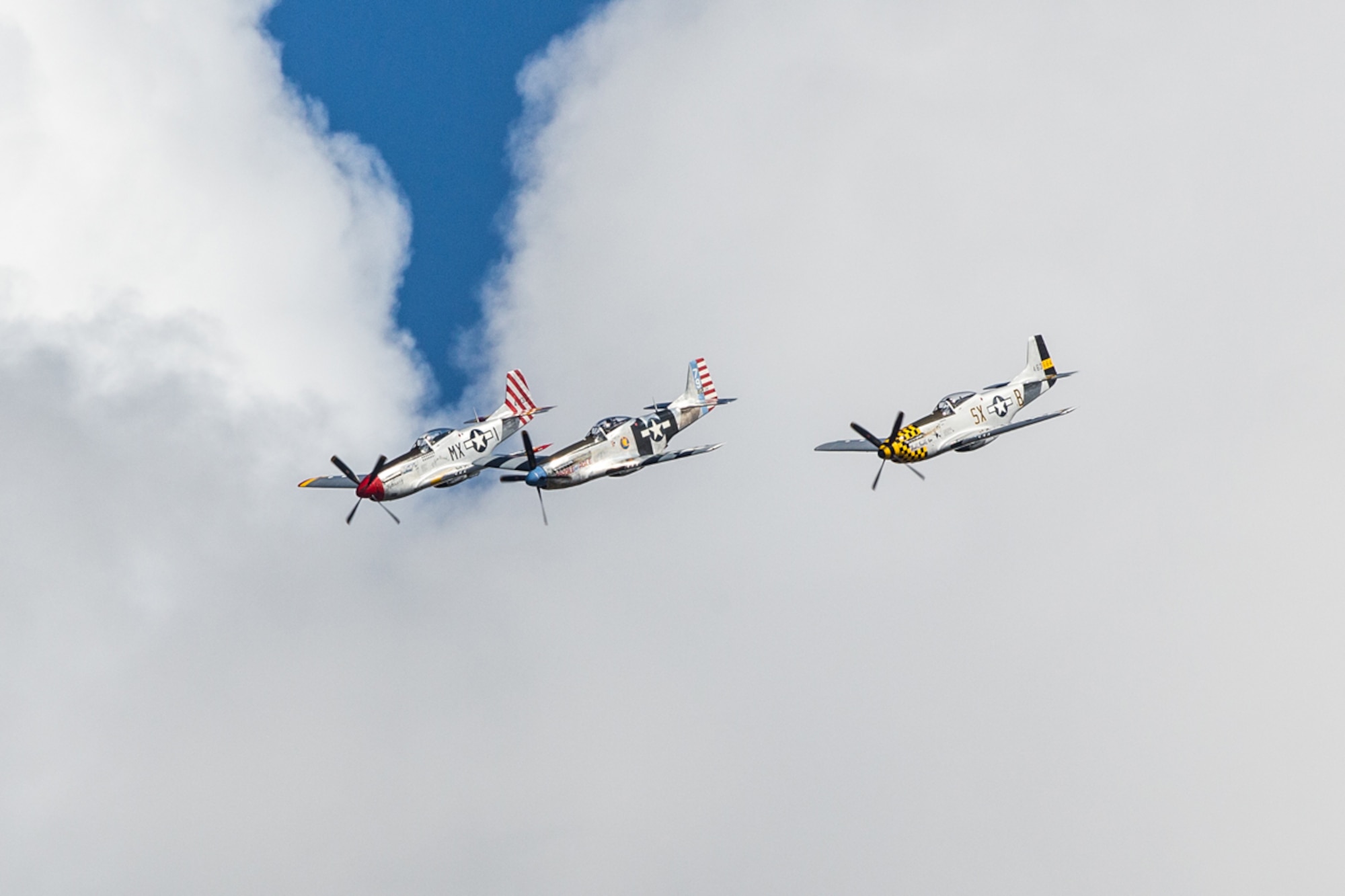 JOINT BASE ELMENDORF-RICHARDSON, Alaska - The Bremont Horsemen Aerobatic Team fly their World War II-era P-51 Mustangs in a formation at Joint Base Elmendorf-Richardson's Arctic Thunder Open House 2014, July 26. The event features more than 40 Air Force, Army and civilian aerial acts, July 25-27, and has an expected crowd of more than 200,000 people. It is the largest two-day event in the state and one of the premier aerial demonstrations in the world. The 2014 Arctic Thunder Open House is a proud part of the Anchorage Centennial Celebration. (U.S. Air Force photo/Capt. Joel Cooke)