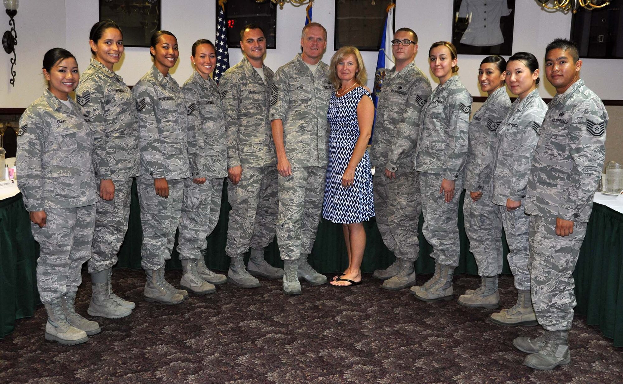 Chief Master Sgt of the Air Force James A. Cody, and his wife, Athena, posed for a photo following breakfast with selected, outstanding Airmen who represented a cross-selection of the March Total Force. CMSAF Cody and Athena visited March Air Reserve Base in Southern California July 11-14, 2014, where they met with Airmen and observed the success of Total Force Integration there. (U.S. Air Force photo/Master Sgt. Linda Welz)