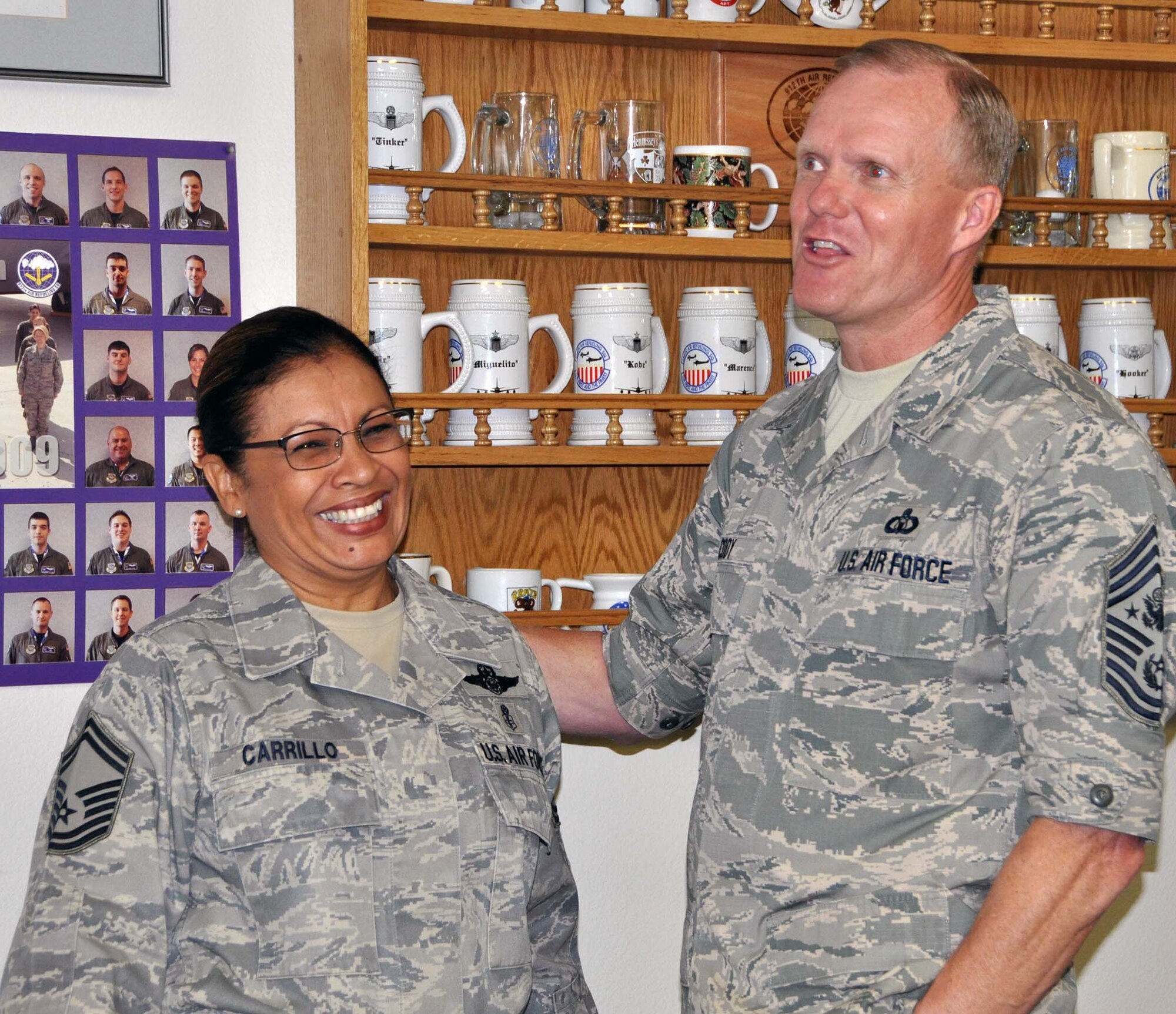 Chief Master Sgt of the Air Force James A. Cody presented his coin to Senior Master Sgt. Josephine Carrillo for her outstanding work as the Yellow Ribbon program manager. CMSAF Cody and Athena visited March Air Reserve Base in Southern California July 11-14, 2014, where they met with Airmen and observed the success of Total Force Integration there. (U.S. Air Force photo/Master Sgt. Linda Welz)