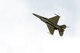 An F-16 Fighting Falcon from the 115th Fighter Wing in Madison, Wis., flies above Volk Field Air National Guard Base, Wis., July 16, 2014. The jets were moved to Volk Field for the month of July to complete mission training, while the Dane County Regional Airport completed runway maintenance and repairs. (Air National Guard photo by Senior Airman Andrea F. Liechti)