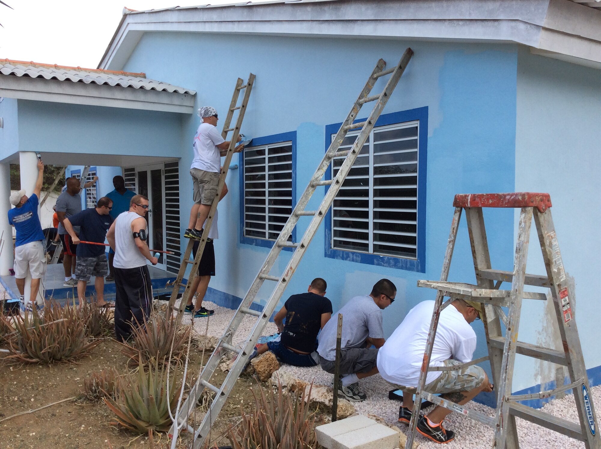 Twenty volunteers from the U.S. Forward Operating Location painted the Siloam Orphanage facility in Curaçao, July 29, 2014.  The volunteers painted the exterior of the building and donated clothing, hygiene products, recreational toys and funds to increase the children’s quality of life.  This project was completed in partnership with the director, Bro Herman, to ensure that the children’s needs were met, including a safe and secure environment. The men and women at the USFOL are frequent volunteers in the local community, to express appreciation for the two countries’ friendship and the wonderful hospitality they have received from the people of Curaçao.  (Courtesy Photo) 