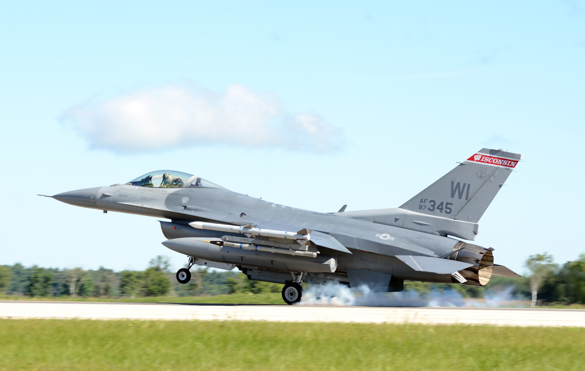 An F-16 Fighting Falcon from the 115th Fighter Wing in Madison, Wis., lands on the runway at Volk Field Air National Guard Base, Wis., July 16, 2014. The jets were moved to Volk Field for the month of July, while the Dane County Regional Airport completed runway maintenance and repairs. (Air National Guard photo by Senior Airman Andrea F. Liechti)