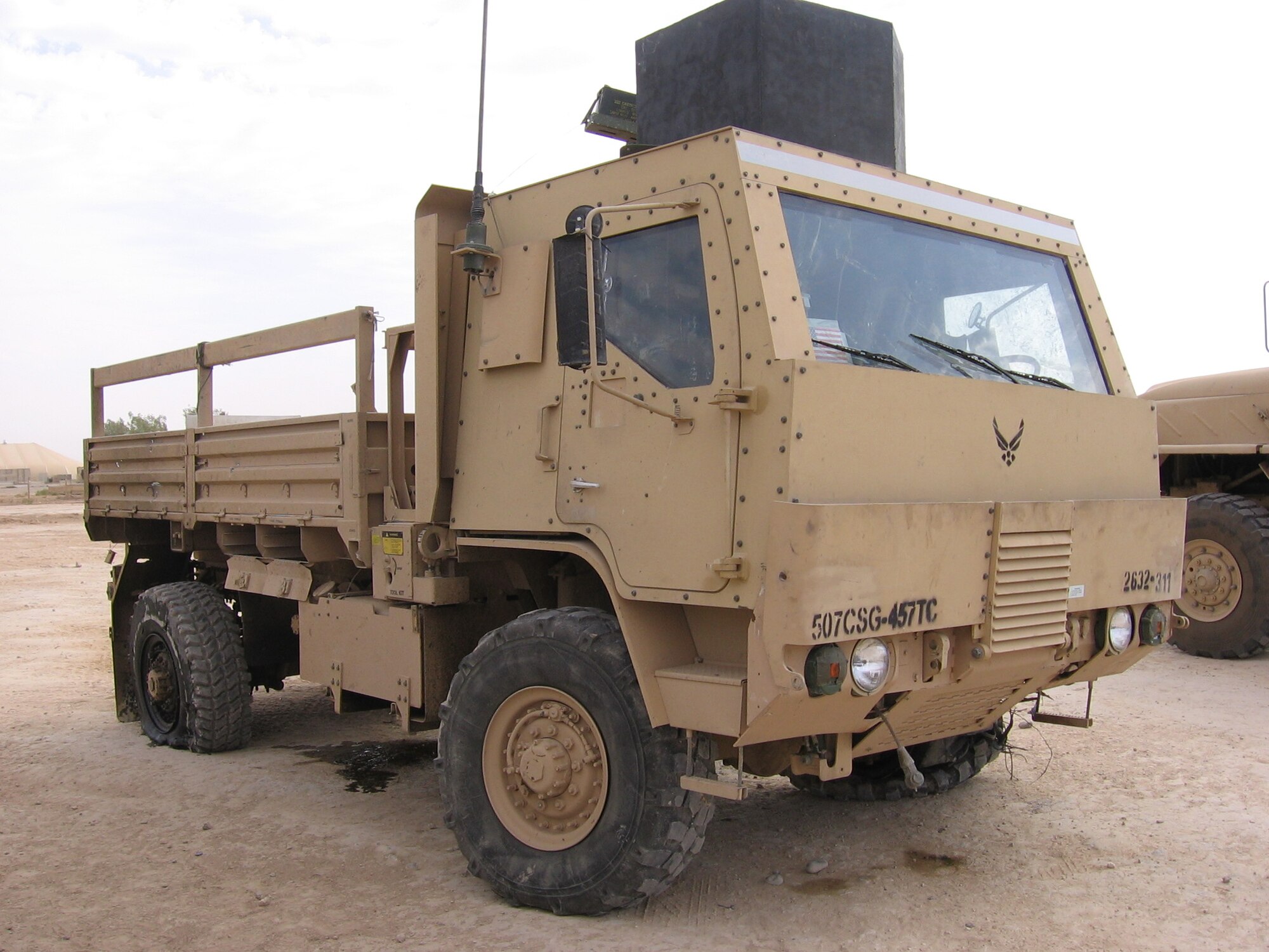 This U.S. Air Force light medium tactical vehicle sustained damage from an improvised explosive device during a deployment in Iraq, 2005. Staff Sgt. Jimmy Boulware, at the time an Airman 1st Class, rode as truck commander in this LMTV when the IED went off as he rode past. (courtesy photo)  