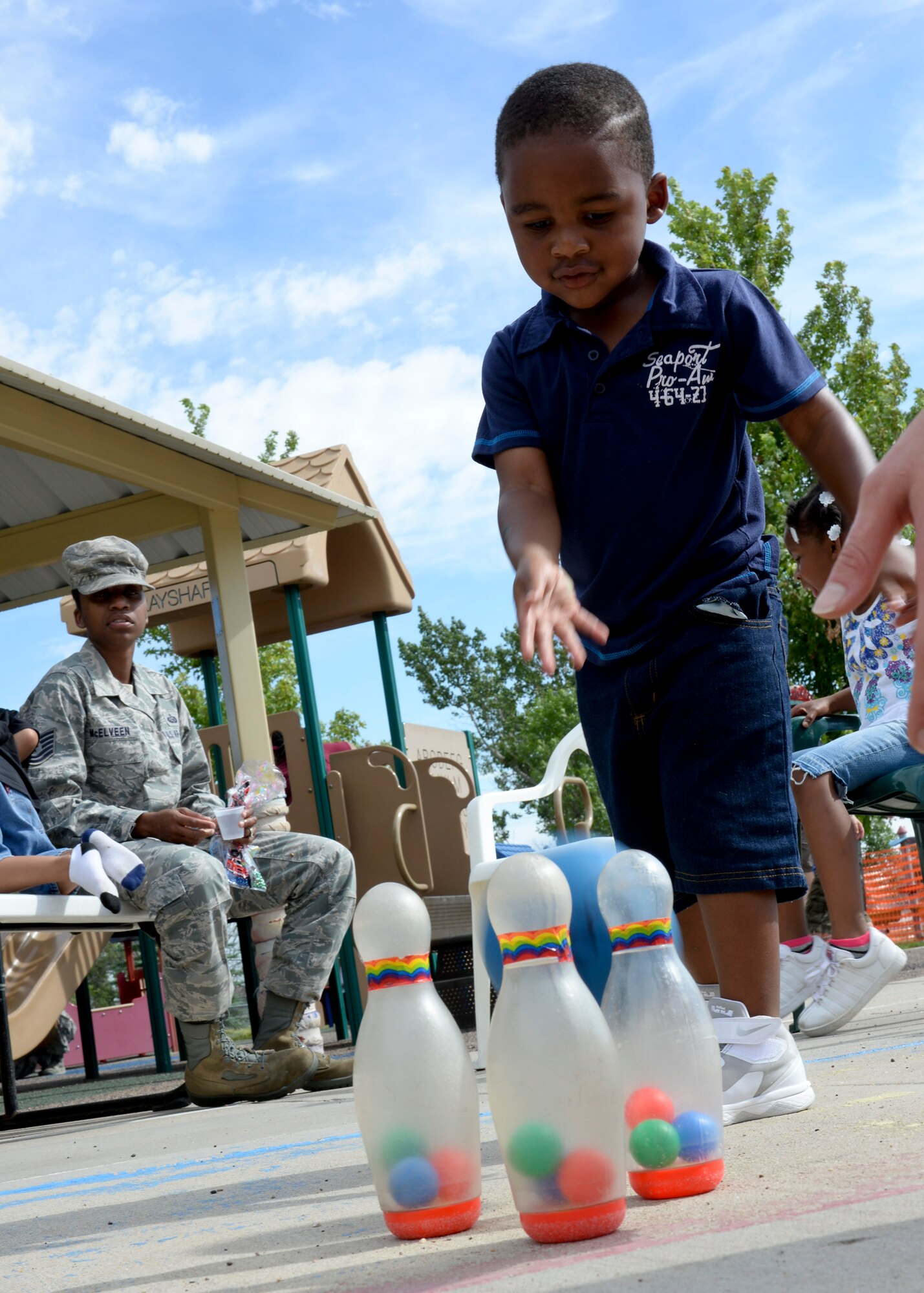 Christopher McElveen, son of Tech. Sgt.’s Christopher McElveen, 28th Maintenance Squadron aircraft fuel systems technician, and Anique McElveen, 28th Maintenance Group unit training manager, participate in the Child Development Center’s Summer Carnival at Ellsworth Air Force Base, S.D., July 24, 2014. CDC staff, along with Airmen and families, set up the carnival to provide activities and games for CDC children to enjoy. (U.S. Air Force photo by Senior Airman Anania Tekurio/Released)