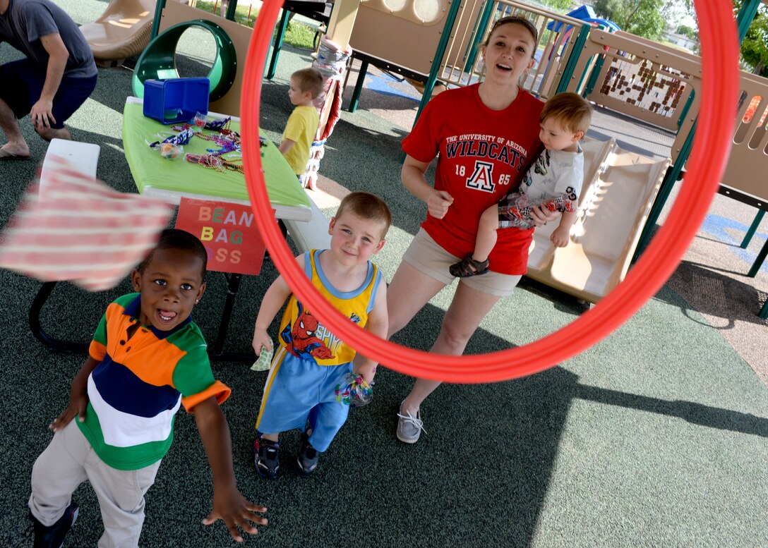 Airmen and their families gather for fun and games at the Child Development Center’s Summer Carnival at Ellsworth Air Force Base, S.D., July 24, 2014. A total of 120 children attended the carnival to celebrate summer’s end prior to school beginning. (U.S. Air Force photo by Senior Airman Anania Tekurio/Released)