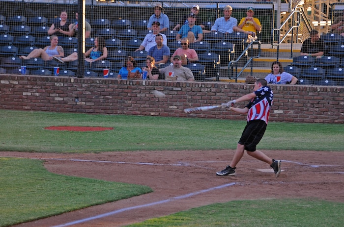 Senior Airman Addam LaMora, Beale All-Stars second baseman, takes a swing during a softball game with the Marysville Gold Sox July 30, 2014, at Appeal-Democrat Park in Marysville, Calif. More than 100 guests attended the game. (U.S. Air Force photo by Airman 1st Class Ramon A. Adelan/ Released)