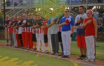 Beale All-Stars stand for the National Anthem during a softball game against the Marysville Gold Sox July 30, 2014, at Appeal-Democrat Park in Marysville, Calif.The Beale All-Stars came out victorious in a 7-4 win. (U.S. Air Force photo by Airman 1st Class Ramon A. Adelan/ Released)