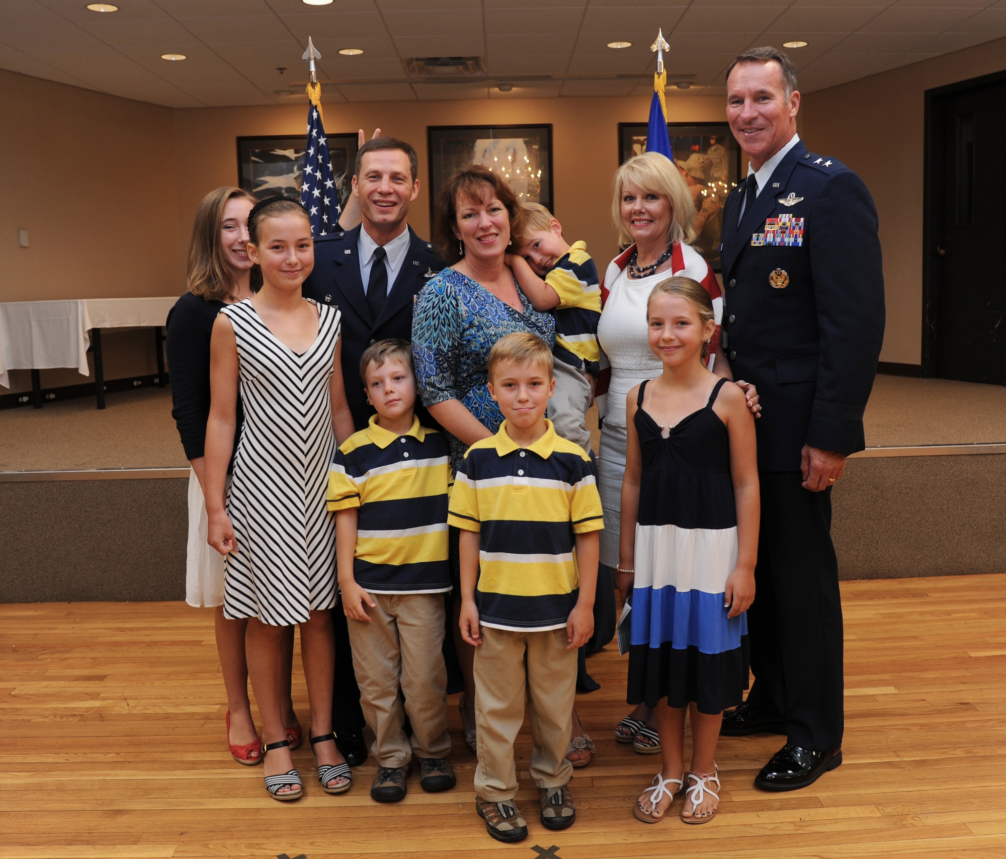 Col. James Dryjanski, 31th Airlift Wing commander, poses for a photo with his family and Maj. Gen. Michael Keltz, the director of Intelligence, Operations and Nuclear Integration, Headquarters Air Education and Training Command, and his wife July 31, 2014, at Little Rock Air Force Base, Ark. Dryjanski joins Team Little Rock with his wife, Celeste, and six children: Katherin, Alexis, Zoey, Thomas, Joshua, and Adam.  (U.S. Air Force photo by Airman 1st Class Mercedes Muro) 


