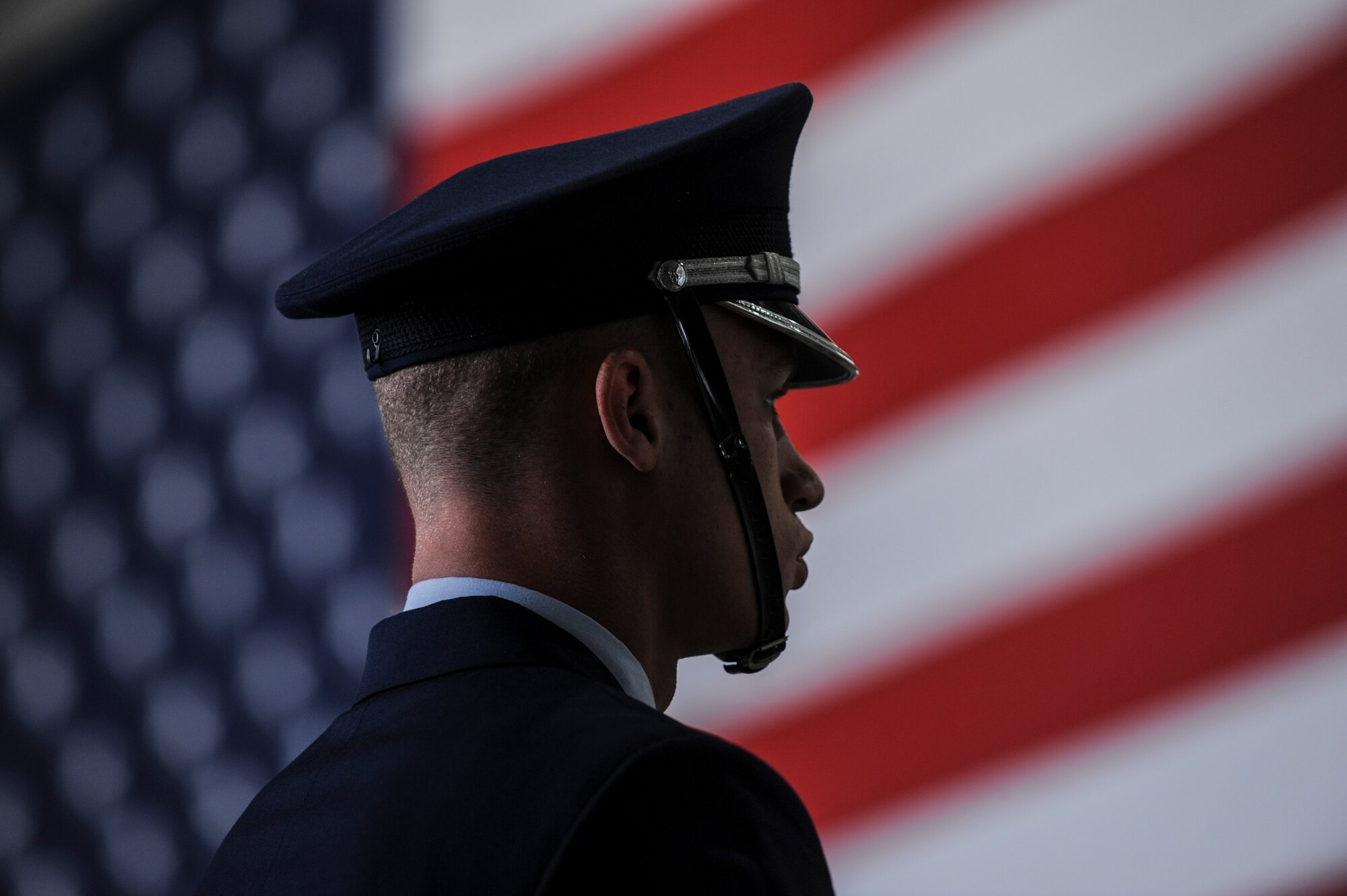 Senior Airman Linwood Harrison, a Little Rock Air Force Base ceremonial guardsmen, stands at parade rest prior to the 314th Airlift Wing change of command ceremony July 31, 2014, at Little Rock AFB, Ark. Col. James Dryjanski assumed command of the 314th AW during the change of command. (U.S. Air Force photo by Airman 1st Class Cliffton Dolezal)