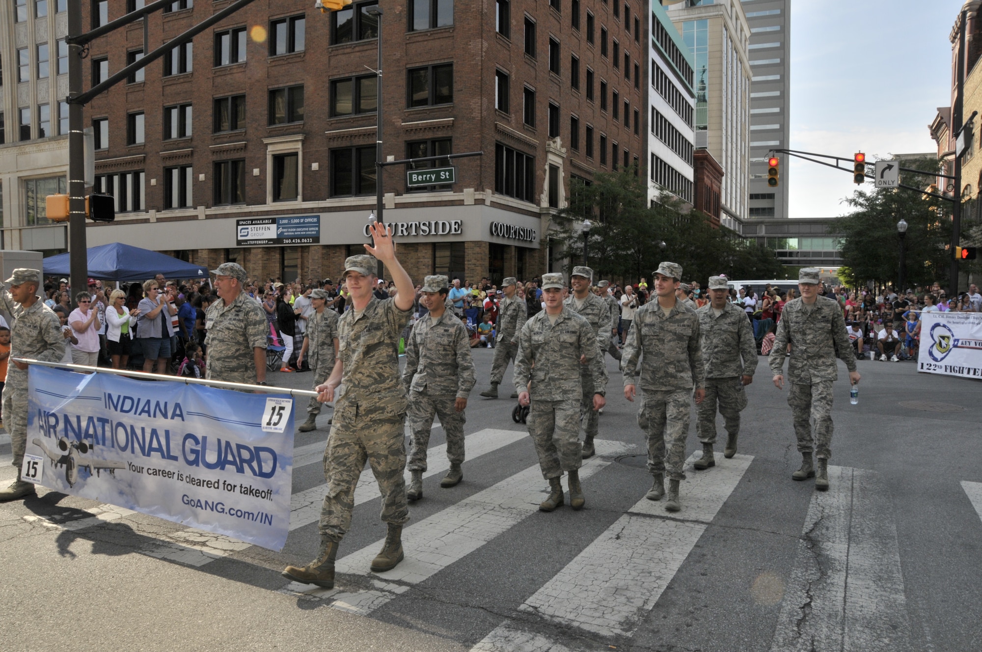 Members from the 122nd Fighter Wing, Fort Wayne, Indiana participate in the 46th Annual Three Rivers Festival Parade, July 12, 2014, held on the streets of downtown Fort Wayne. The yearly parade, attended by approximately 50,000 people, allows the wing to show its community support. (Air National Guard photo by Airman 1st Class Justin Andras/Released)