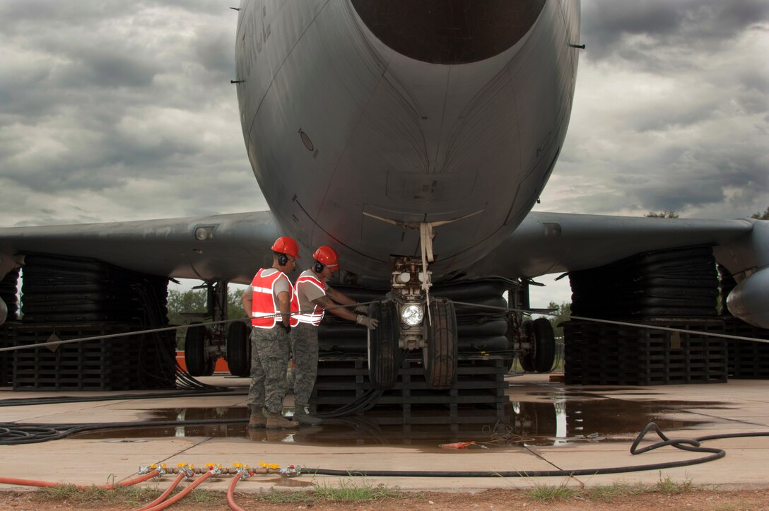 Instructors from the 362nd Training Squadron, Crash Damaged Disabled Aircraft Recovery (CDDAR) team, used 26-ton airbag modules and associated equipment to completely lift a KC-135 Stratotanker July 29, 2014. Students work as a team to lift the aircraft off the ground a minimum of 8 inches, which can be applied to any aircraft that has skidded off the runway or is stuck in the mud, snow or any other terrain. (U.S. Air Force photo/Danny Webb/RELEASED)